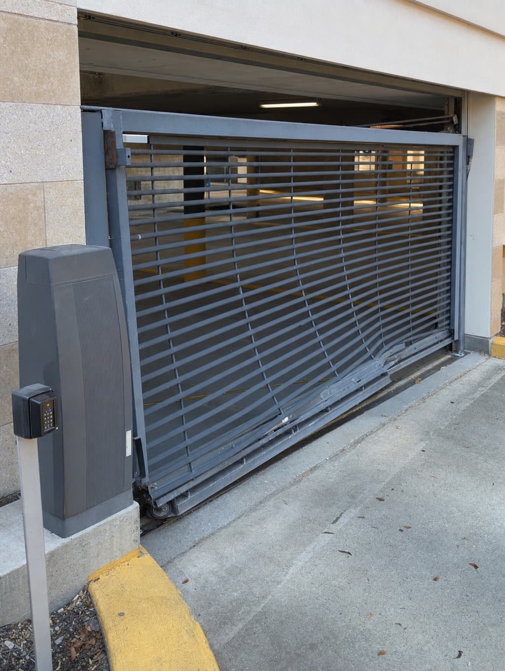 A damaged parking-garage security gate captured in the Alevyn Capture app